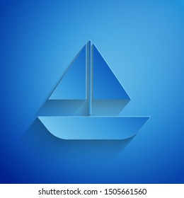 Paper cut Yacht sailboat or sailing ship icon isolated on blue background. Sail boat marine cruise travel. Paper art style. Vector Illustration