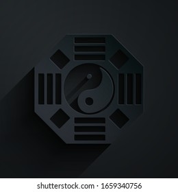 Paper cut Yin Yang symbol of harmony and balance icon isolated on black background. Paper art style. Vector Illustration