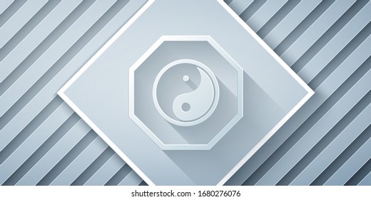 Paper cut Yin Yang symbol of harmony and balance icon isolated on grey background. Paper art style. Vector Illustration