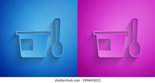 Paper cut Yogurt container with spoon icon isolated on blue and purple background. Yogurt in plastic cup. Paper art style. Vector