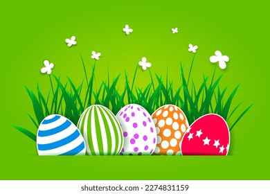 Paper cutout Easter eggs, green grass and butterflies. Easter background