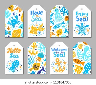 Paper cutout marine kids design element tags. Funny cartoon turtle, fish, octopus, shell, calmar, starfish, jellyfish doodle vector illustration. Lettering phrase I love, Enjoy, Hello, Welcome to sea