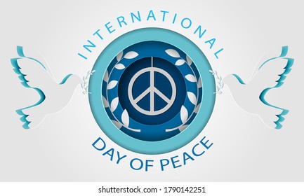 Paper cutout pigeon with leaf symbol of peace. international peace day
