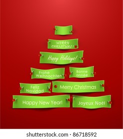 Paper cuts in the shape of Christmas tree with different holidays messages. Vector Illustration