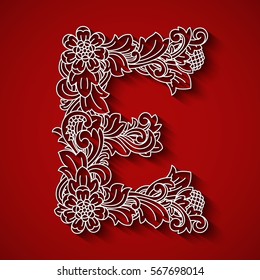Paper cutting, white letter "E". Red background. Floral ornament, balinese traditional style.