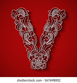 Paper cutting, white letter "V". Red background. Floral ornament, balinese traditional style.