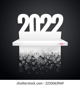 Papierdokument 2022 wird auf dunklem Hintergrund in Schneeflocken geschnitten
