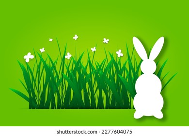 Paper Easter rabbit silhouette, green grass and butterflies. Easter background