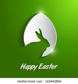 paper egg with shadow Easter card. Easter egg with bunny shape over green background.