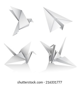 paper figures of birds and airplane on a white background 