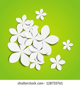 Paper flowers on green background
