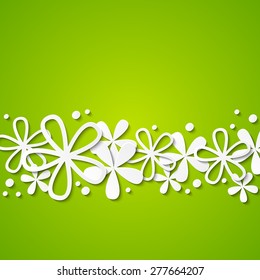 Paper flowers on green background