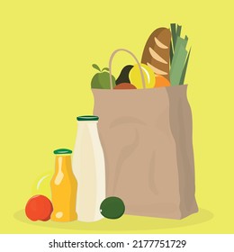 Paper grocery bag with products on yellow background