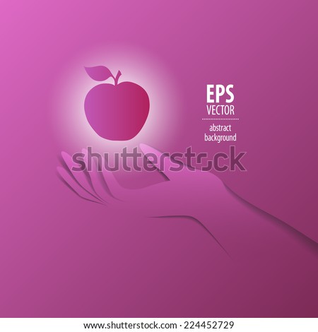 Paper hand with shiny apple 