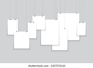 paper hanging from string black and white