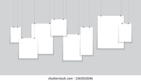 paper hanging from string black and white