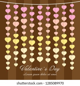 Paper heart shape mobile pink and yellow color decoration on the wall in valentine's day