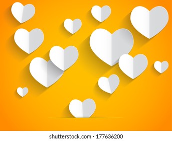 Paper hearts on orange background