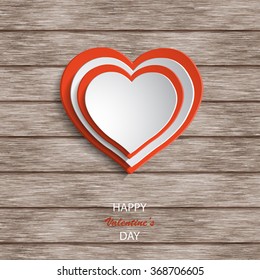 Paper hearts on wooden background. Valentines day. Abstract card
