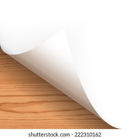 Paper lower left corner with wooden background