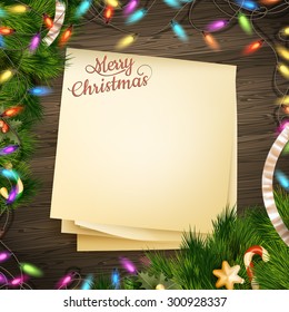 Paper note banner for holidays greeting message and Christmas decoration on a wooden backgroun. EPS 10 vector file included