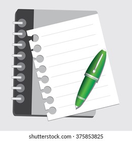 paper notebook and  green pen on white background