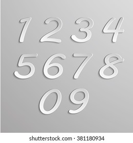 Paper numbers set on gray background