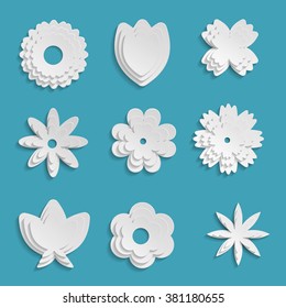 Paper origami flowers on aqua-blue background