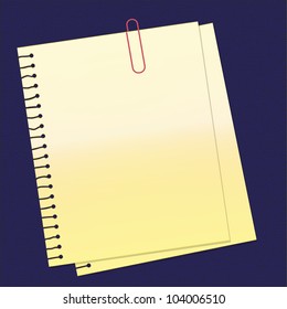 paper and paperclip on leather pad