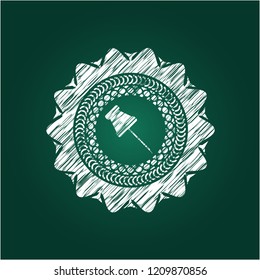 paper pin icon drawn on a chalkboard