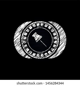paper pin icon drawn on blackboard