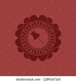 paper pin icon inside badge with red background