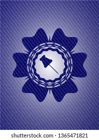 paper pin icon inside badge with denim texture