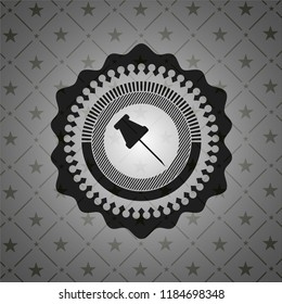 paper pin icon inside black emblem