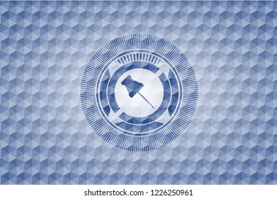 paper pin icon inside blue emblem with geometric pattern.