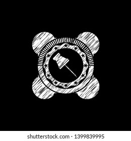 paper pin icon inside chalk emblem written on a blackboard