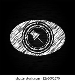 paper pin icon inside chalkboard emblem on black board