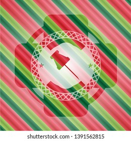paper pin icon inside christmas badge.