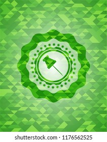 paper pin icon inside green emblem with triangle mosaic background