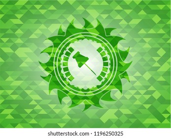 paper pin icon inside green emblem with triangle mosaic background