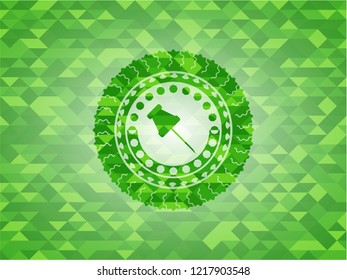 paper pin icon inside green emblem. Mosaic background