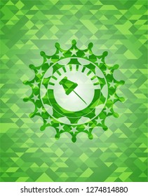 paper pin icon inside green emblem with triangle mosaic background