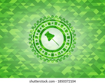 paper pin icon inside green emblem. Mosaic background. 