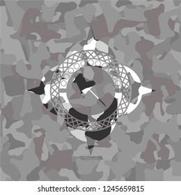 paper pin icon inside grey camouflage texture