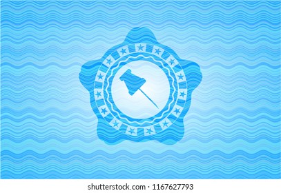 paper pin icon inside light blue water style emblem.