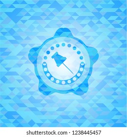 paper pin icon inside light blue emblem with mosaic background