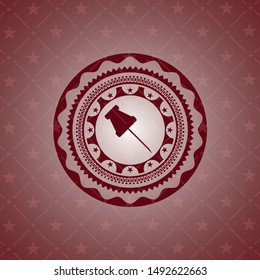 paper pin icon inside red emblem