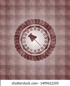 paper pin icon inside red seamless badge with geometric pattern.