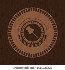 paper pin icon inside retro wooden emblem