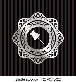 paper pin icon inside silver emblem. 